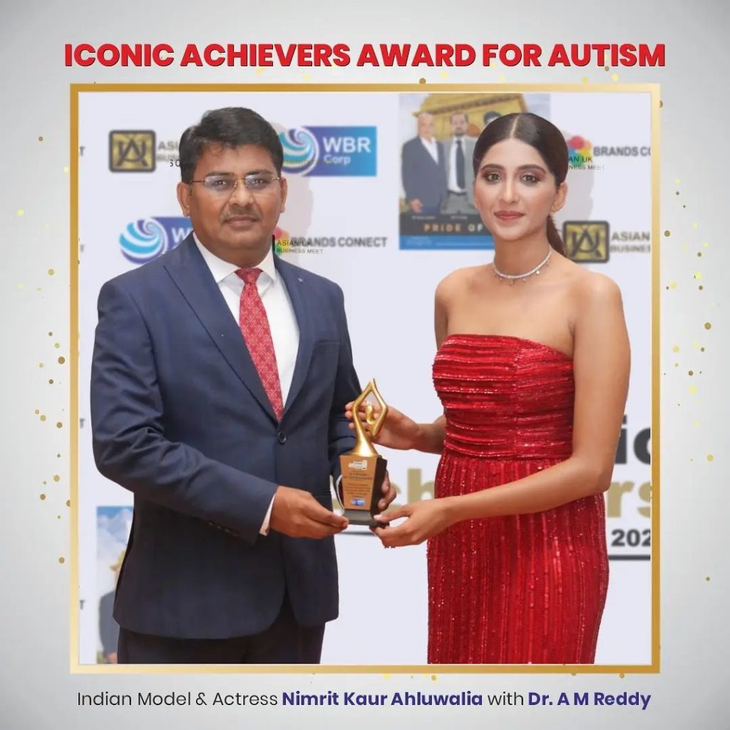 Dr. A. M. Reddy receives Iconic Award for Autism by Forbes India Marquee Magazine from Indian Actress Nimrit Kaur Ahluwalia 